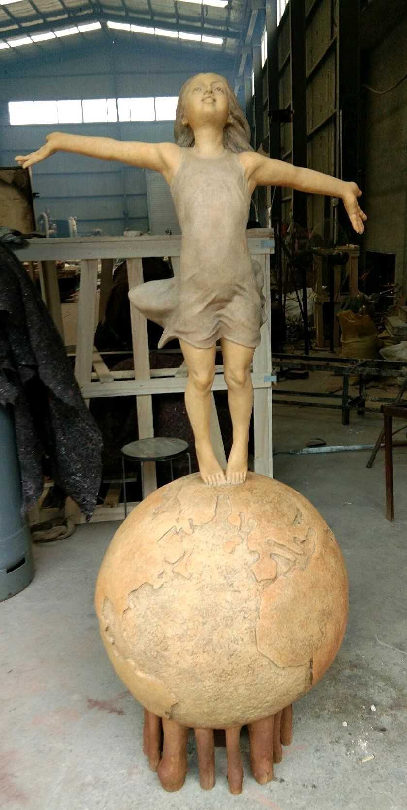 Girl Standing on Globe